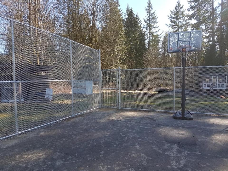 Chain-link recreational court perimeter and walk-through gate; LS project in Langley.